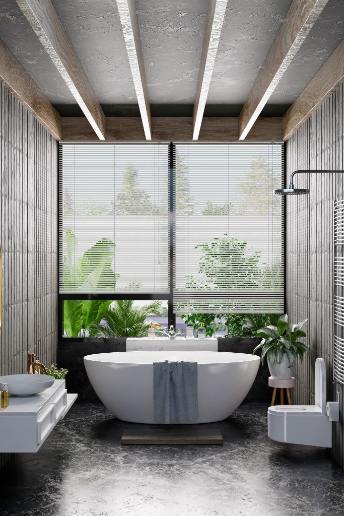 A chic Japandi bathroom with venetian blinds and free standing bath.