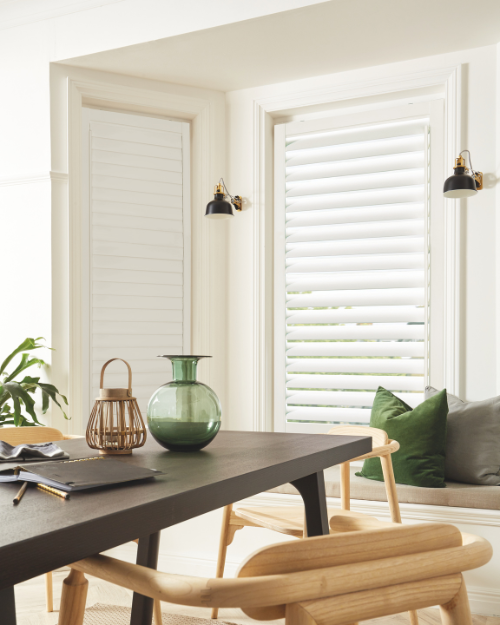 Day and night blinds in small dining room.