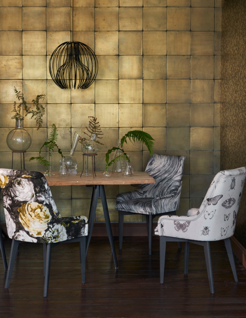 Metallic shades in a stylish dining area. 