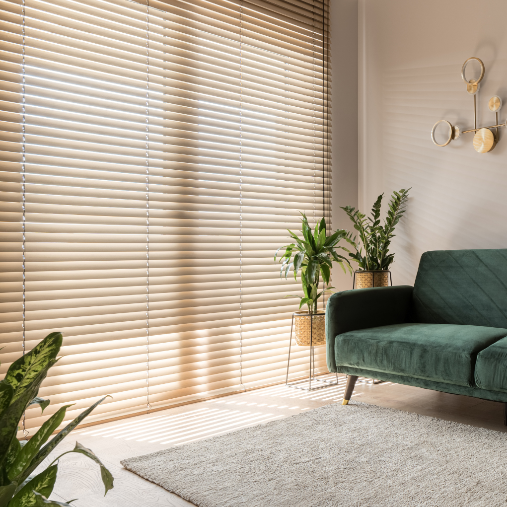 living room featuring wooden blinds and neutral tones