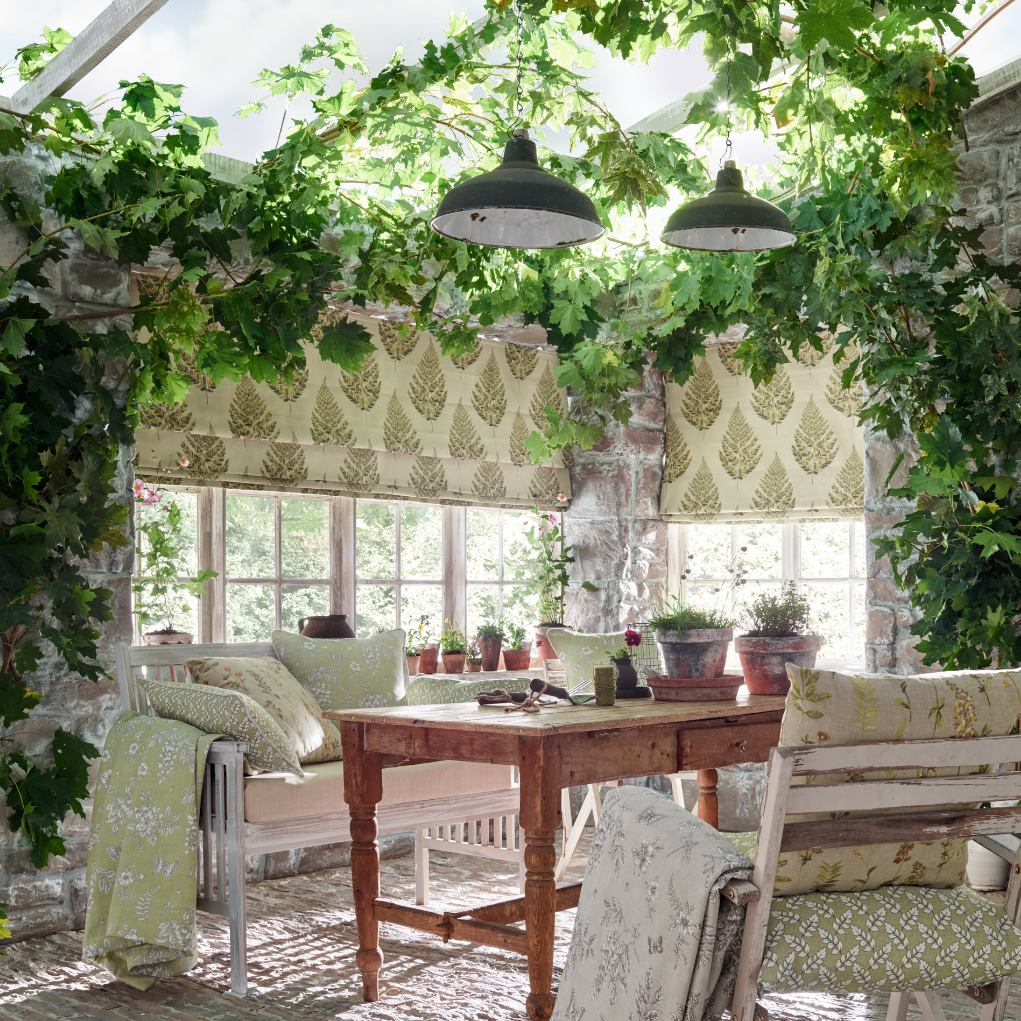 conservatory featuring roman blinds and plants