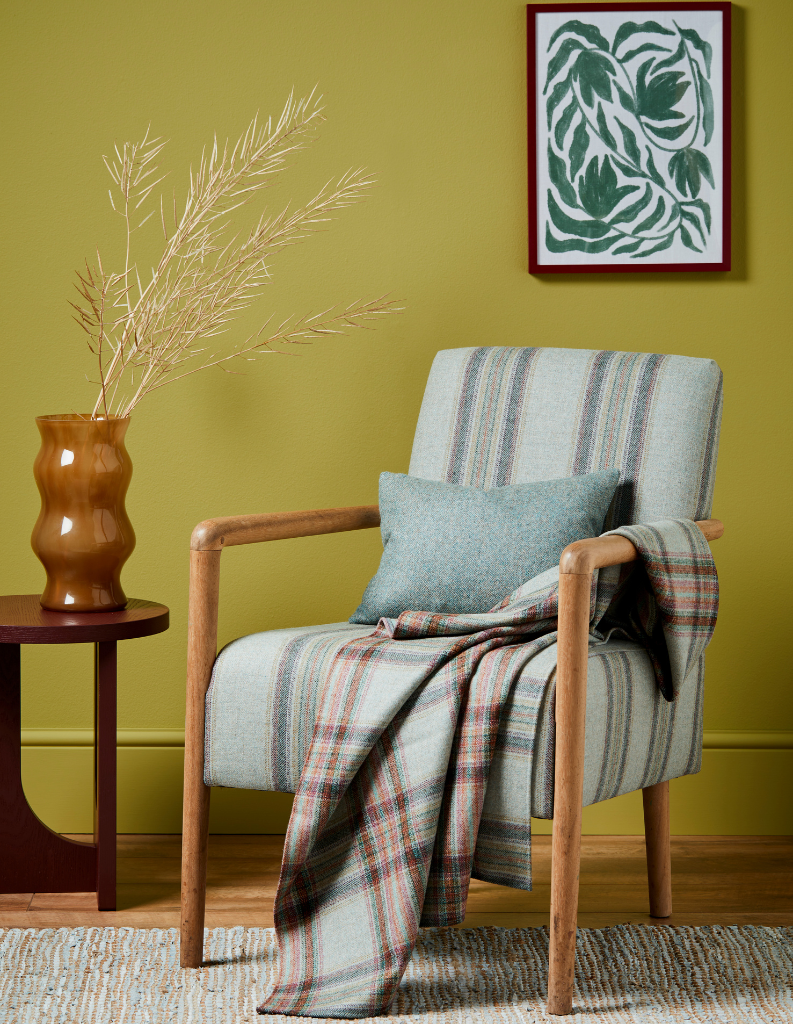 armchair with tartan throw and side table.