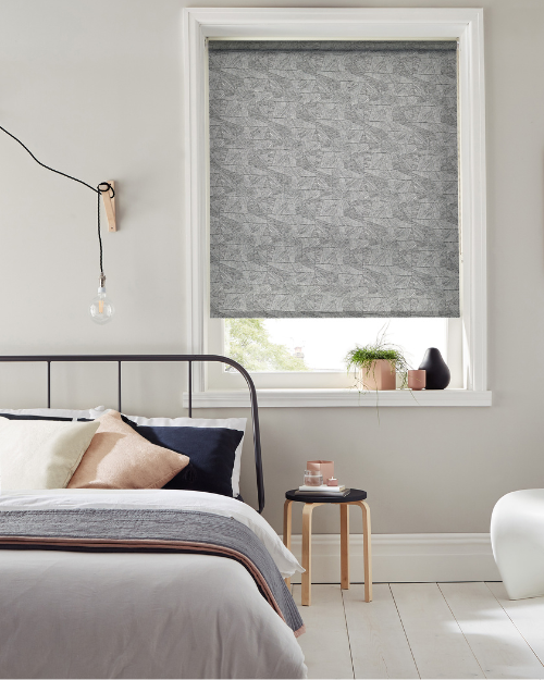 Roller blinds in bedroom.