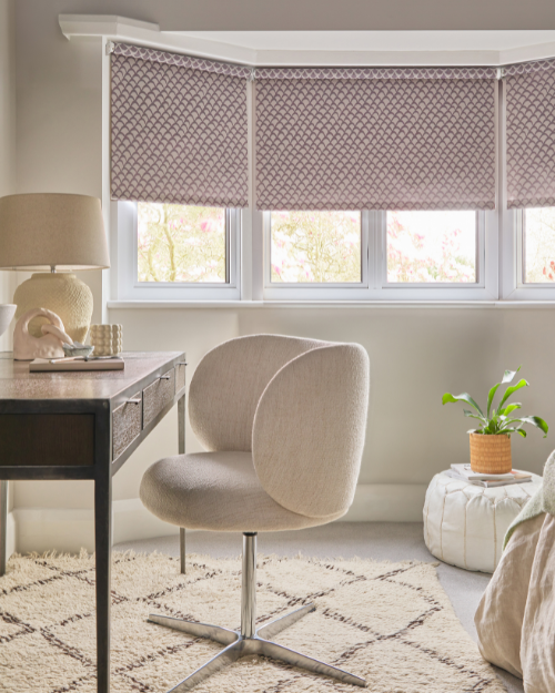 Roller blinds in home office.