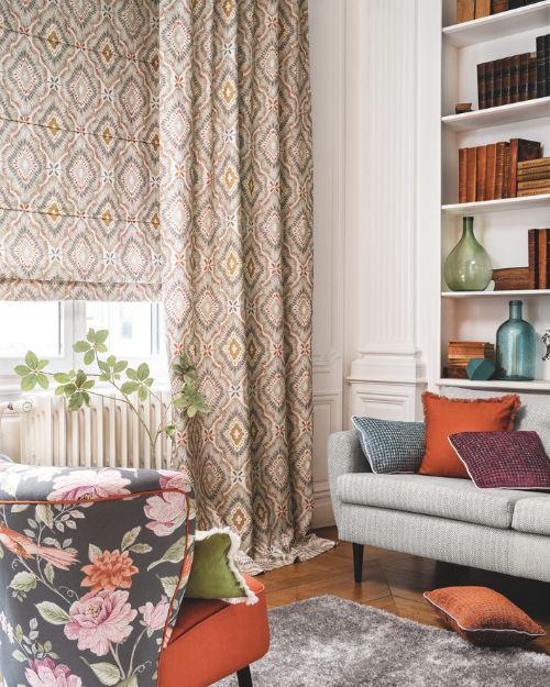 Matching patterned roman blind and curtains in living room.