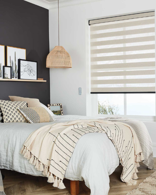 Day and night blinds in bedroom.
