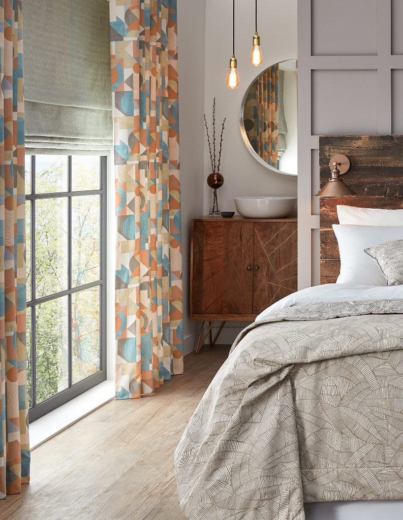 Roman blind with curtains in bedroom.