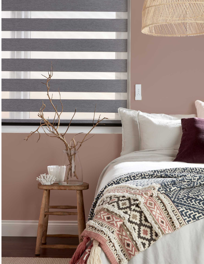 Grey day and night blind in bedroom.