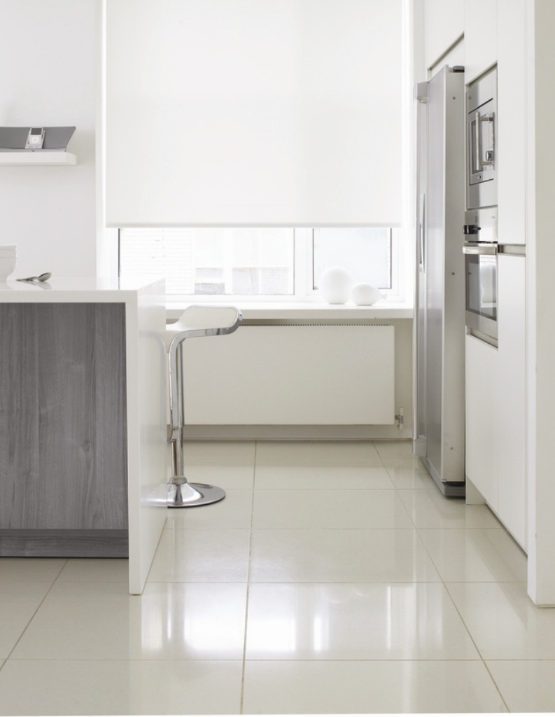 White roller blind in kitchen with bar.